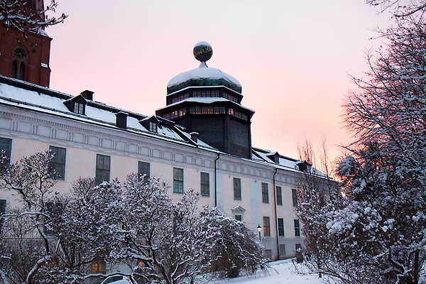 Gustavianum at sunset on a snowy day